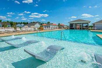 Two heated saltwater pools with sundeck & lounge ledge